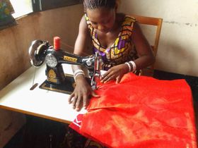 Deborah is happy to learn how to sew. She's determined to expand the knowledge to other vulnerable single mothers in her community.