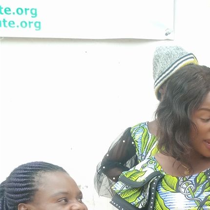 Women full of happiness for their acquired skills in tailoring.